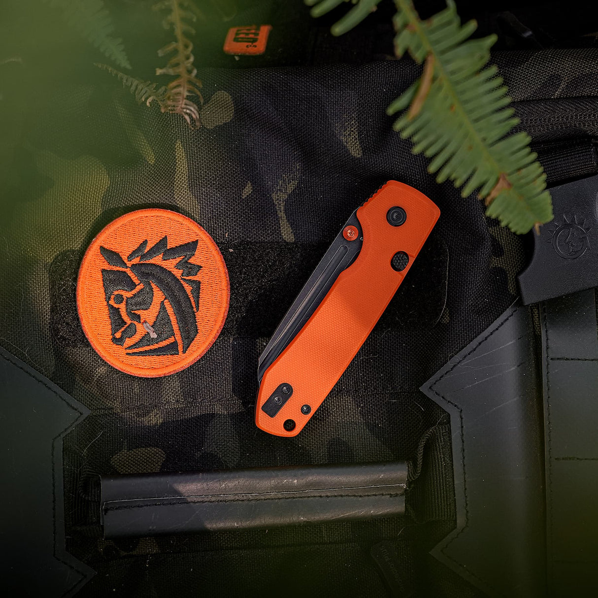 Raccoon 2.0 Top Liner Lock | Orange G10 + Blackwash 14C28N Sheepsfoot - A2931